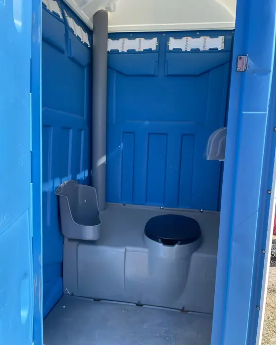 Clean blue porta potty interior after a service visit